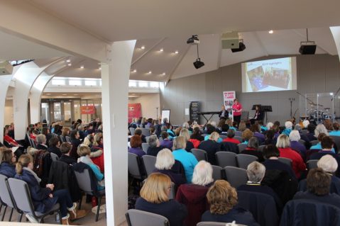 GB volunteers listening at conference